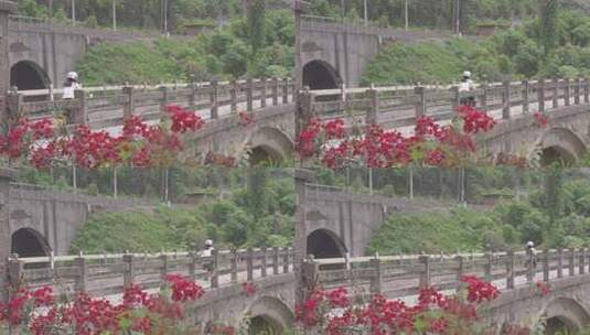 女子骑着MINI摩托车过桥高清在线视频素材下载