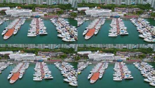 航拍海南三亚游艇旅游中心与帆船港帆船高清在线视频素材下载