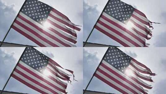 一面破烂的美国国旗在风中慢动作飘扬。高清在线视频素材下载