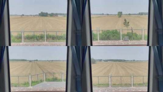 行驶中的火车窗外的村庄庄稼风景2高清在线视频素材下载
