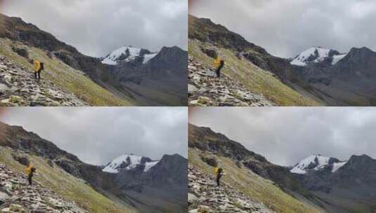 攀登贡嘎山卫峰乌库楚雪山的登山者徒步行进高清在线视频素材下载