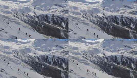 四川甘孜攀登乌库楚雪山的登山者大雪中徒步高清在线视频素材下载