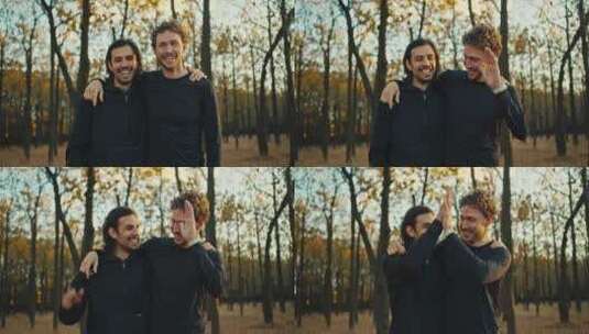 两个快乐开朗的家伙在秋天的森林里摆姿势慢高清在线视频素材下载