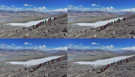 航拍攀登新疆慕士塔格峰雪山的登山队高清在线视频素材下载