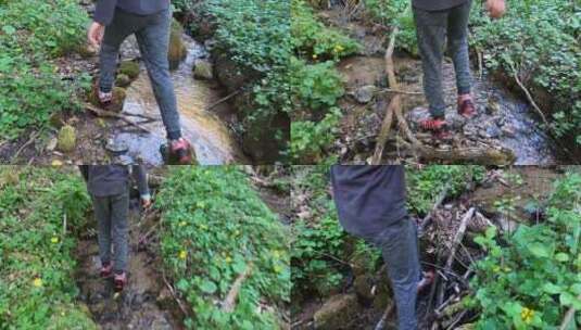 猎人沿着小溪的水迹行走高清在线视频素材下载