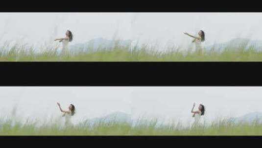 白色连衣裙女子在草地上跳舞高清在线视频素材下载