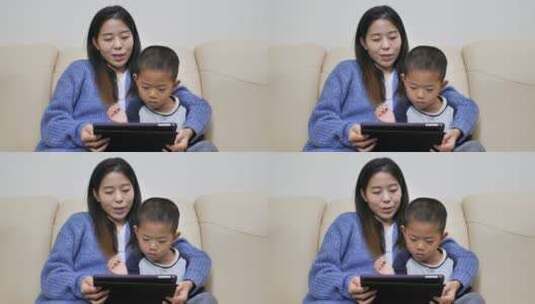 中国女士小朋友居家看书看手机看平板学习高清在线视频素材下载