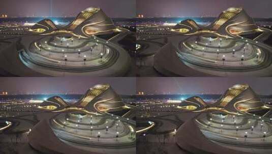 中国黑龙江哈尔滨大剧院夜景航拍高清在线视频素材下载