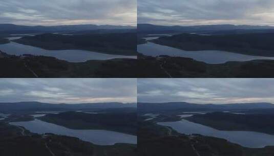 在阿尔泰具有戏剧性天空的湖泊和山脉的鸟瞰图高清在线视频素材下载