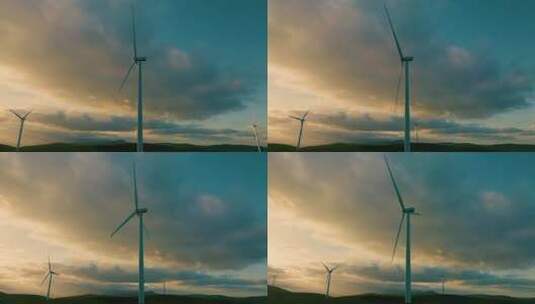 航拍山坡上的风力发电机高清在线视频素材下载