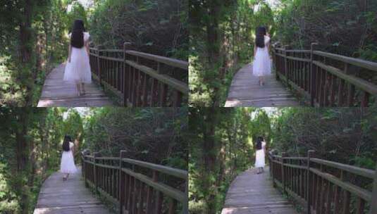 白裙女生林间漫步 感受自然高清在线视频素材下载