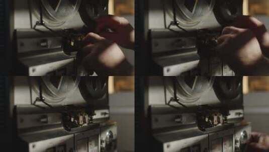 人的手在旧卷轴磁带录音机上重新填充磁带的特写镜头高清在线视频素材下载