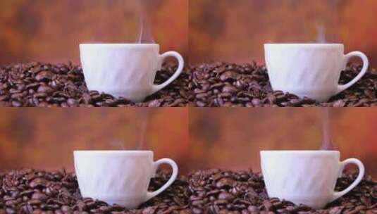 摇摄咖啡豆堆里冒着热气的咖啡杯高清在线视频素材下载