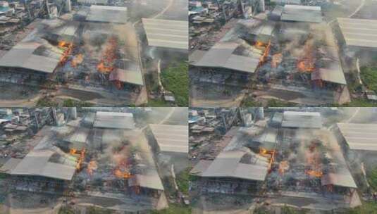 大火吞噬工业建筑的强烈鸟瞰图。高清在线视频素材下载