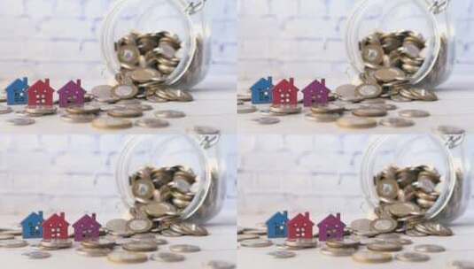 硬币堆和桌上的房子房子金融的概念高清在线视频素材下载