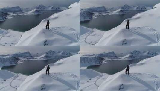 登山者站在雪山顶部高清在线视频素材下载