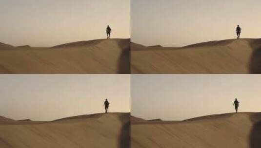 走在沙漠里的人高清在线视频素材下载