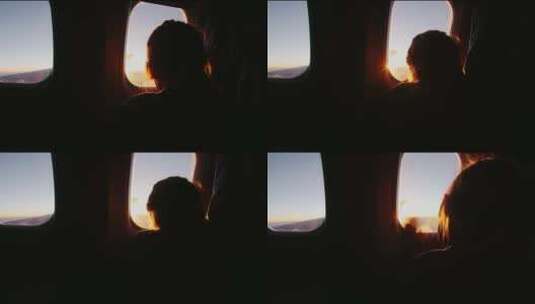 快乐的小女孩透过飞行飞机的窗户看高清在线视频素材下载