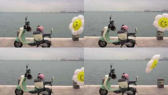 海边唯美场景电动车上的气球随风飘逸高清在线视频素材下载