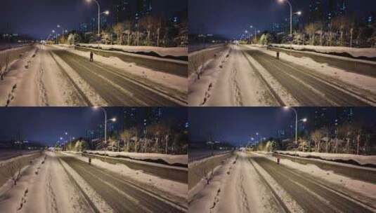 一个人独自在积雪的道路上行走高清在线视频素材下载