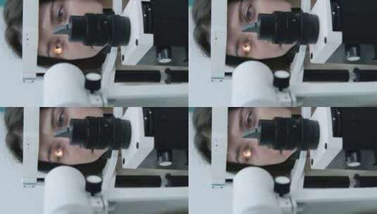 细心的验光师在眼科诊所用裂隙灯检查美丽的高清在线视频素材下载