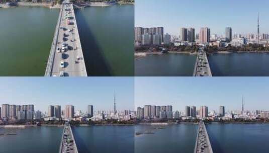 俯视车流拉出大桥中轴摇城市高清在线视频素材下载