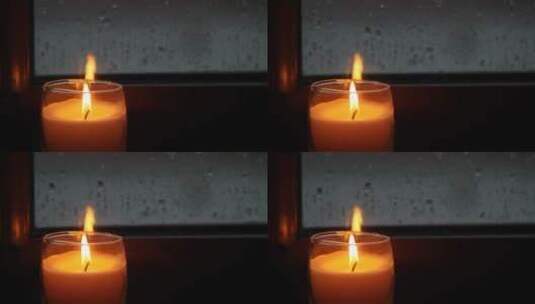 雨后窗户旁的蜡烛高清在线视频素材下载