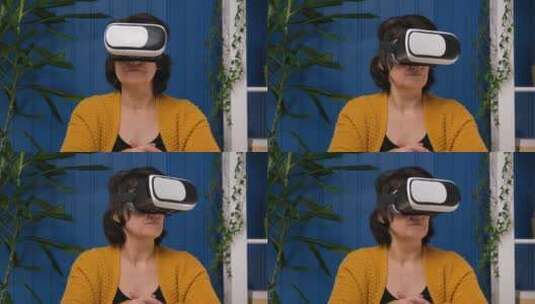 女人用vr眼镜玩游戏高清在线视频素材下载