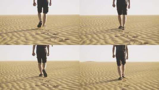 沙漠中步行的男人高清在线视频素材下载
