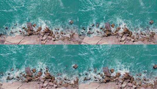 俯拍海浪拍打礁石高清在线视频素材下载