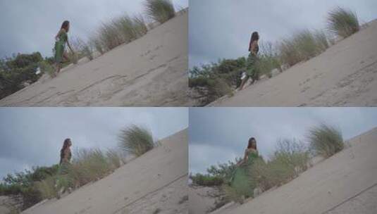 女人沿着沙丘向上走高清在线视频素材下载