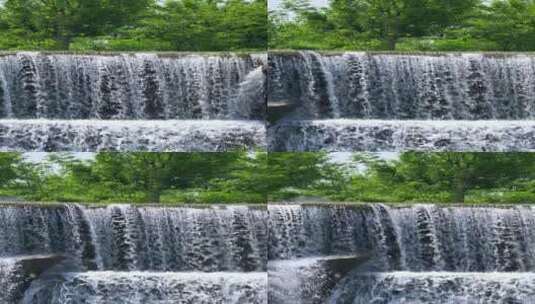 4K升格实拍公园里的人造景观瀑布竖屏高清在线视频素材下载