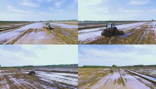 航拍拖拉机在稻田平整土地高清在线视频素材下载