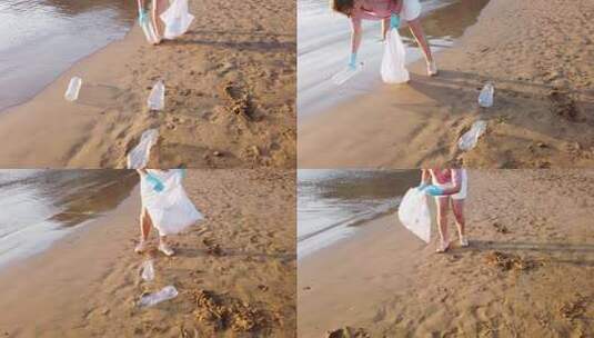 海滩上捡瓶子的女人高清在线视频素材下载