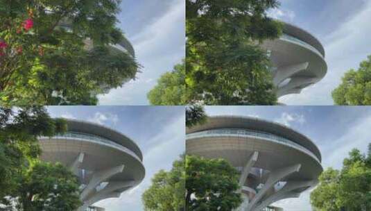 风景蓝天白云树木围绕异形建筑高清在线视频素材下载