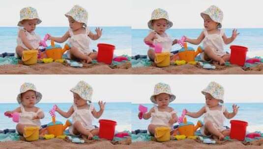 双胞胎女婴坐在海滩上玩沙子高清在线视频素材下载