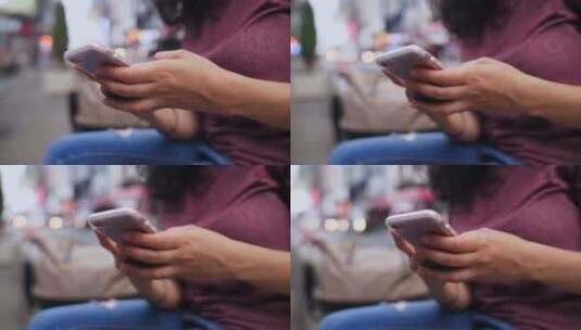一位年轻的拉丁裔女性在她的手机上输入了一条信息高清在线视频素材下载