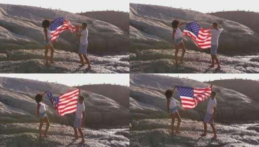阳光海滩上举着美国国旗的夫妇高清在线视频素材下载
