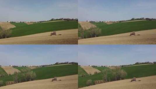 农业公司红色拖拉机下坡耕作和准备农业有机土壤的空中高清在线视频素材下载