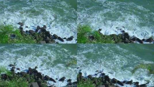 4K升格实拍海岸边潮水拍打礁石激起浪花高清在线视频素材下载