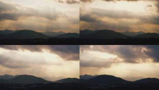 阳光穿透乌云照射山峰丁达尔光延时耶稣光高清在线视频素材下载