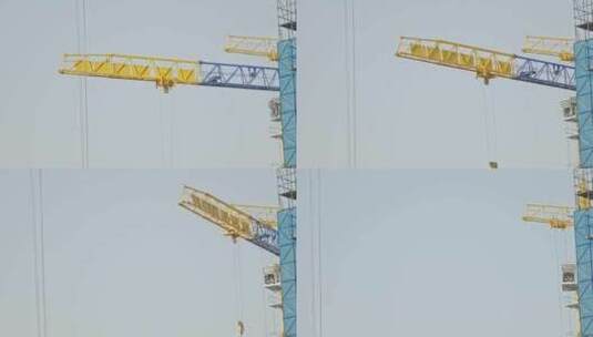 建筑施工工地工业起重机塔吊运行特写高清在线视频素材下载