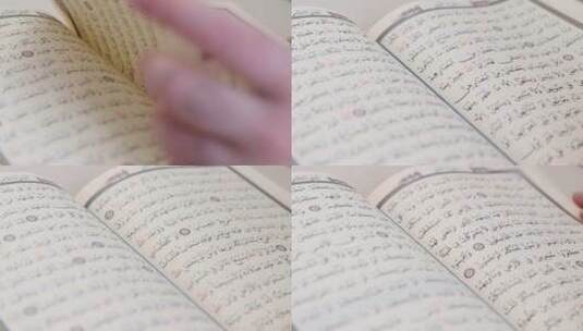 学者翻看古兰经高清在线视频素材下载