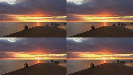 海边夕阳情侣在拍照高清在线视频素材下载