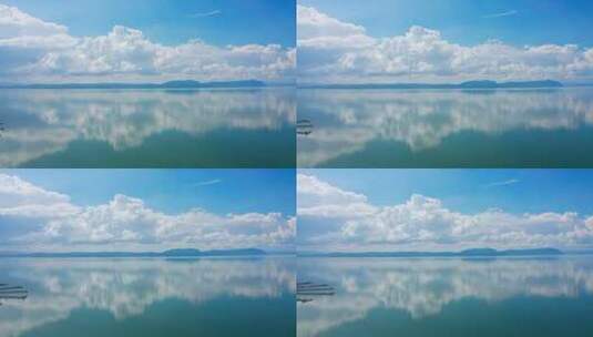 蓝天白云下的湖泊倒影航拍高清在线视频素材下载