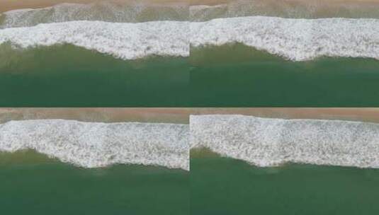 航拍海边的海浪冲向海边高清在线视频素材下载