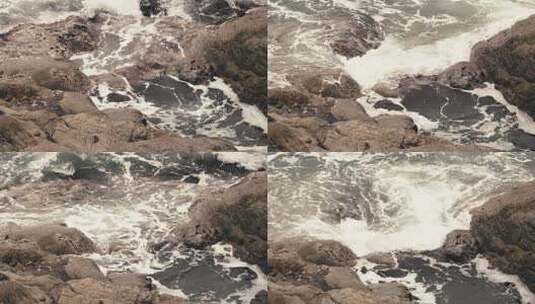 4K拍摄海水的浪花拍打在礁石上高清在线视频素材下载