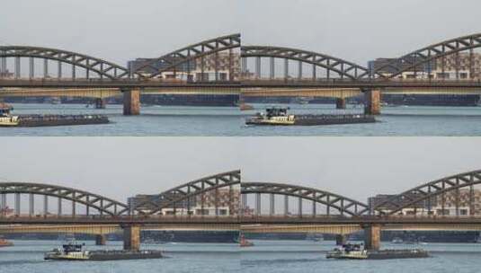 列车游船驶过大桥高清在线视频素材下载