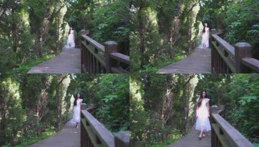 白裙女生林间漫步 感受自然高清在线视频素材下载