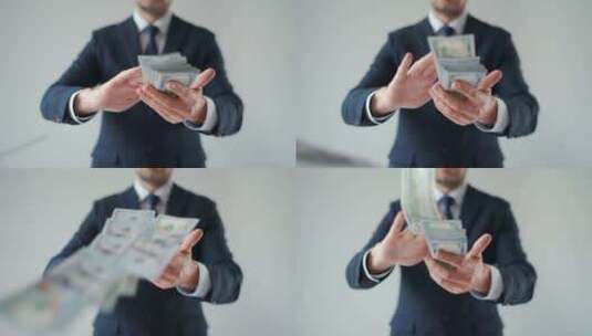 男人用钞票制造金钱雨高清在线视频素材下载